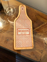 Personalized glass cutting board fits on top of the box that holds wine and cheese tools.